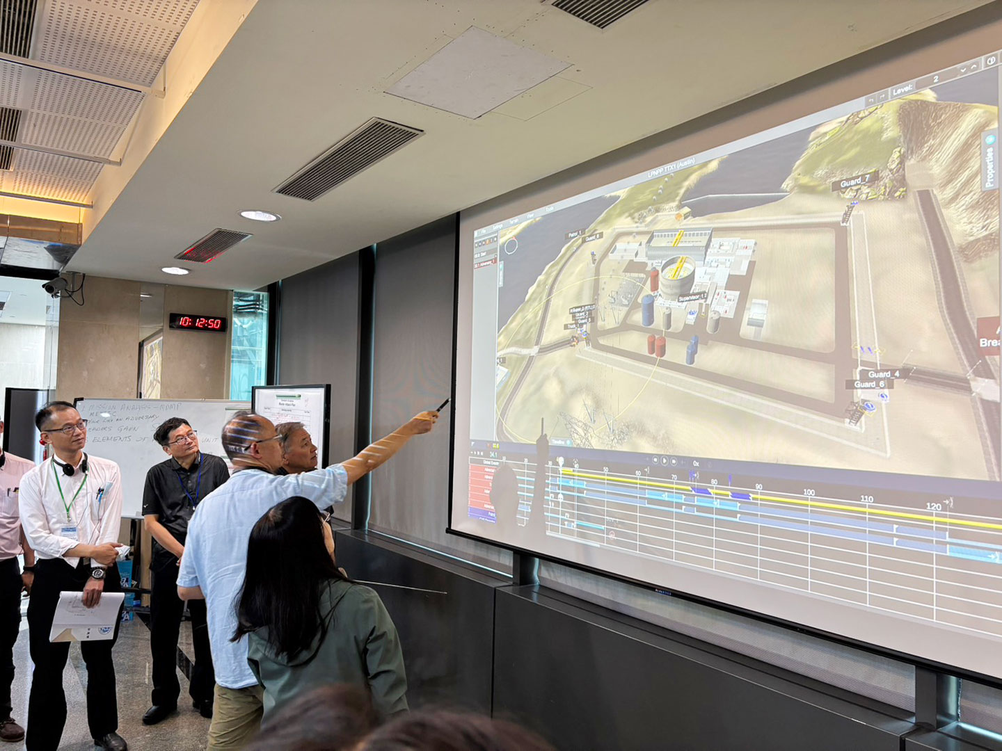 Image(3):Discussion of defense strategies during the tabletop exercise